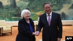 US Treasury Secretary Janet Yellen (L) shakes hands with Chinese Premier Li Qiang at the Great Hall of the People in Beijing on April 7, 2024.