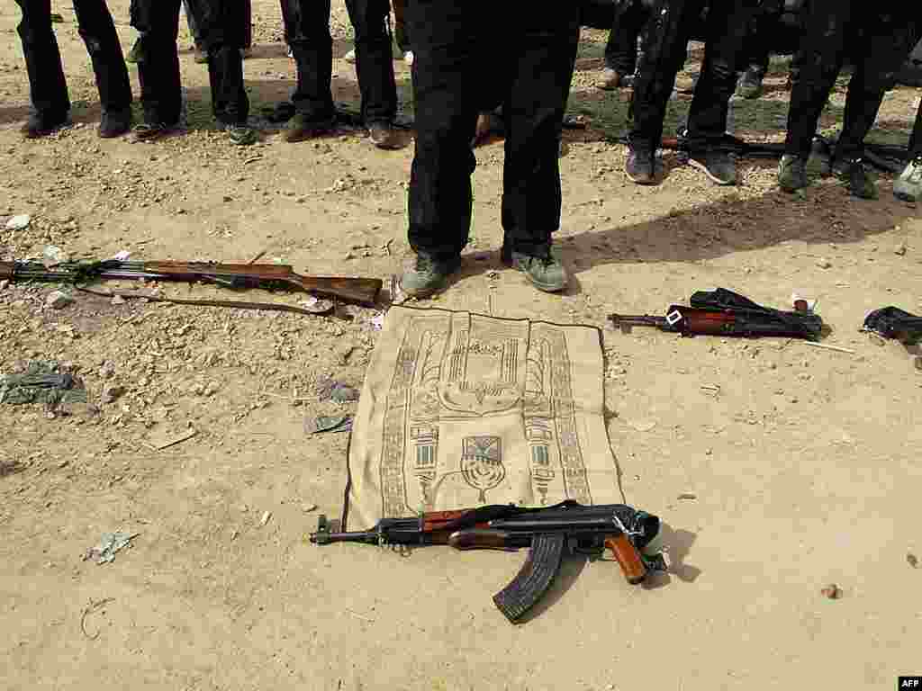 Free Syrian army fighters perform noon prayers in a neighborhood in Damascus. (AP)