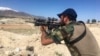 An Afghan commando stands guard at Pandola village, near the site of the U.S. forces' bombing in Achin district of Jalalabad, east of Kabul, Afghanistan, April 14, 2017. 