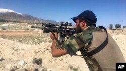 An Afghan commando stands guard at Pandola village, near the site of the U.S. forces' bombing in Achin district of Jalalabad, east of Kabul, Afghanistan, April 14, 2017. 