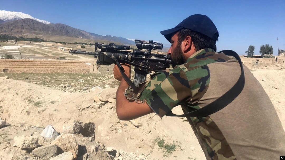 An Afghan commando stands guard at Pandola village, near the site of the U.S. forces' bombing in Achin district of Jalalabad, east of Kabul, Afghanistan, April 14, 2017. 