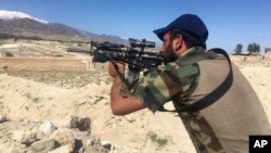 An Afghan commando stands guard at Pandola village, near the site of the U.S. forces' bombing in Achin district of Jalalabad, east of Kabul, Afghanistan, April 14, 2017. 