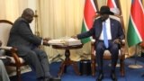 FILE - South Sudan's President Salva Kiir sits with ex-vice president and former rebel leader Riek Machar before their meeting in Juba, South Sudan, Sept. 11, 2019.