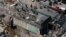 Rescue personnel search the scene of a building collapse in downtown Philadelphia, Pennsylvania, June 5, 2013.