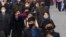 FILE - People wear face mask amid the concern over the spread of the coronavirus in Pyongyang, North Korea, April, 1, 2020. 