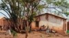 FILE - Children sit on a tree branch in Lilongwe, Malawi, Oct. 4, 2018. The country's government has announced it is taking steps to better protect children from being forced or tricked into prostitution. Rights campaigners are not convinced.