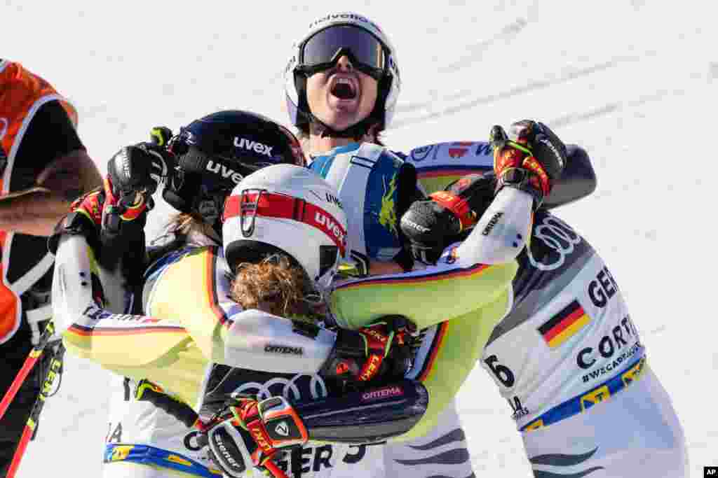 Germany team celebrates winning bronze medal in the mixed team parallel slalom, at the Alpine Ski World Championships in Cortina d'Ampezzo, Italy.