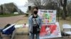 Alex Lee protests in Washington, D.C., in this undated photo in hopes of inspiring more people in China to be pro-democracy advocates. (Photo courtesy of Alex Lee)