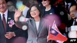 FILE - Taiwan President Tsai Ing-Wen waves during National Day celebrations in front of the Presidential Palace, in Taipei, Taiwan, Oct. 10, 2019.