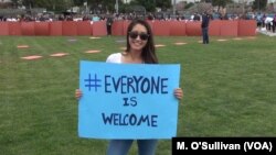  Volunteer at LAX Everyone is Welcome rally.