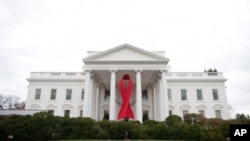 The White House in Washington is decorated with a red ribbon to commemorate World Aids Day, 30 Nov 2010