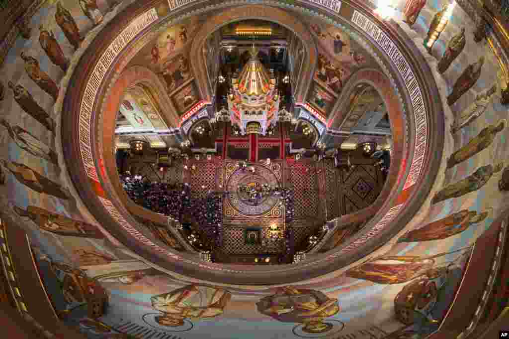 Russian Orthodox believers line up to kiss the relics of Saint Nicholas, center, in the Christ the Savior Cathedral in Moscow, Russia. Relics of Saint Nicholas, one of the Russian Orthodox Church&#39;s most revered figures, arrived in Moscow from an Italian church where they have lain for 930 years.