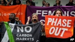 Activists participate in a protest at the COP29 U.N. Climate Summit in Baku, Azerbaijan, Nov. 16, 2024.