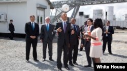 President Barack Obama tosses a Soccket ball in the air at the Ubongo Power Plant in Dar es Salaam, Tanzania, July 2, 2013. 