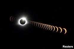 FILE—A composite image of 21 separate photographs shows the solar eclipse as it creates the effect of a diamond ring seen from Clingmans Dome in the Great Smoky Mountains National Park, Tennessee, U.S. August 21, 2017