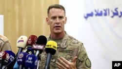 U.S. Army Colonel Ryan Dillon, spokesman for Operation Inherent Resolve, the U.S.-led coalition against the Islamic State group, speaks during a press conference in Baghdad, Iraq, Aug. 24, 2017. 
