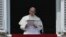 FILE - Pope Francis speaks his studio window overlooking St. Peter's Square at the Vatican, Feb. 21, 2016.
