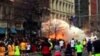 In this image from video provided by WBZ TV, spectators and runners run from what was described as twin explosions that shook the finish line of the Boston Marathon, April 15, 2013. 