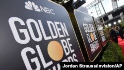 FILE - Signage promoting the 77th annual Golden Globe Awards and NBC appears in Beverly Hills, Calif. on Jan. 5, 2020. 
