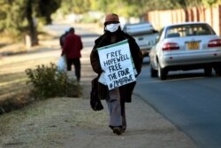 Zimbabwean writer and filmaker Tsitsi Dangarembwa demonstrates outside the house of Hopewell Chin'onos Harare, July 20, 2020.