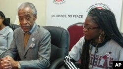 The Rev. Al Sharpton is joined by Aalayah Eastmond, a junior at Marjory Stoneman Douglas High School in Parkland, Fla., during the National Action Network weekly meeting, April 7, 2018, in the Harlem neighborhood of New York. Eastmond and Sharpton announced that a June rally will be held in front of President Donald Trump's Manhattan apartment to protest gun violence.