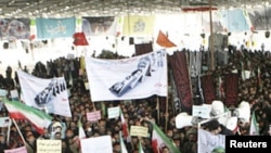 Iranians take part in the funeral of Sanee Zhaleh, a student who was shot dead during an opposition rally on in Tehran, February 16, 2011.