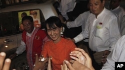 Aung San Suu Kyi is greeted by supporters as she in Burma. (File)