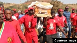 Pall bearers carry the body of the late MDC-T youth, Rebecca Mafikeni, who died while in detention after more than two years in jail.