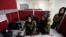 From left, Second Lieutenant Roshan Gul, First Lieutenant Nelofar Frotan and Second Lieutenant Morsal Afshar work at the human resources office in the Ministry of Defense in Kabul, Afghanistan, Oct. 31, 2016. 