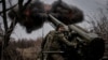 (FILE) A serviceman of the Ukrainian Armed Forces fires a self-propelled howitzer towards Russian troops at a front line near the town of Chasiv Yar in Donetsk region, Ukraine November 18, 2024.