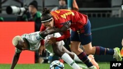 Spain's defender #12 Oihane Hernandez (R) and Zambia's forward #17 Racheal Kundananji fight for the ball during the Australia and New Zealand 2023 Women's World Cup Group C football match between Spain and Zambia at Eden Park in Auckland on July 26, 2023.