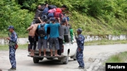 Ethnic Rakhine people who fled from Maungdaw after Arakan Rohingya Salvation Army (ARSA) had attacked, arrive in Buthidaung, Myanmar, Aug. 28, 2017.