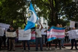 Demonstrators protest a deal Guatemalan President Jimmy Morales' government signed with Washington forcing Salvadoran and Honduran migrants to request asylum in Guatemala instead of the U.S., in Guatemala City, July 31, 2019.