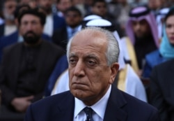 FILE - Washington peace envoy Zalmay Khalilzad attends the inauguration ceremony for Afghan President Ashraf Ghani at the presidential palace in Kabul, Afghanistan, March 9, 2020.