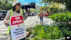 Estella Fontanilla, a housekeeper on strike from Hilton Hawaiian Village, leads hotel workers in strike chants in Honolulu, Hawaii, Sept. 24, 2024. More than 4,300 hotel workers are now on strike at Hilton, Hyatt, and Marriott hotels in Hawaii, California, and Washington state.