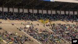 Members of the public sit in the stands during the state funeral for former president Robert Mugabe, at the National Sports Stadium, in the capital Harare, Zimbabwe, Sept. 14, 2019.