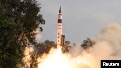 FILE - A surface-to-surface Agni V missile is launched from the Wheeler Island off the eastern Indian state of Odisha.