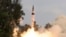 FILE - A surface-to-surface Agni V missile is launched from the Wheeler Island off the eastern Indian state of Odisha, Apr. 19, 2012. The missile, which can hit targets more than 5,000 kilometers away, effectively putting China's northernmost areas within range of Indian nuclear weapons. 