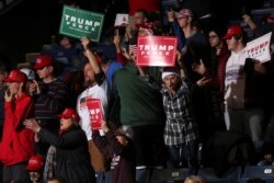 FILE - Supporters react at President Donald Trump's campaign rally in Battle Creek, Mich., Dec. 18, 2019.
