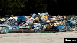 A pile of trash collected after it washed up on shore from the Pacific Ocean