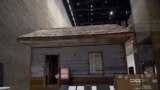 A slave cabin from the Point of Pines Plantation is on display at the National Museum of African American History and Culture in Washington, Sept. 14, 2016. 