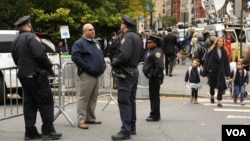 Police stand guard near scene of terrorist attack that targeted a bike path in New York City, Nov. 1, 2017. (R. Taylor / VOA ) 