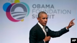 Former President Barack Obama addresses a crowd during the first session of the Obama Foundation Summit in Chicago, Oct. 31, 2017.