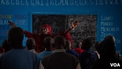 Talibés who were abused by their teachers learn the Koran from teacher Ya Seyda Fatoumata Diof at a shelter Dec. 12, 2019, in Dakar, Senegal. (Annika Hammerschlag/VOA)