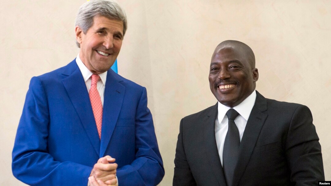 President of the Democratic Republic of Congo (DRC) Joseph Kabila (R) welcomes U.S. Secretary of State John Kerry at the Palais de la Nation in Kinshasa May 4, 2014. 