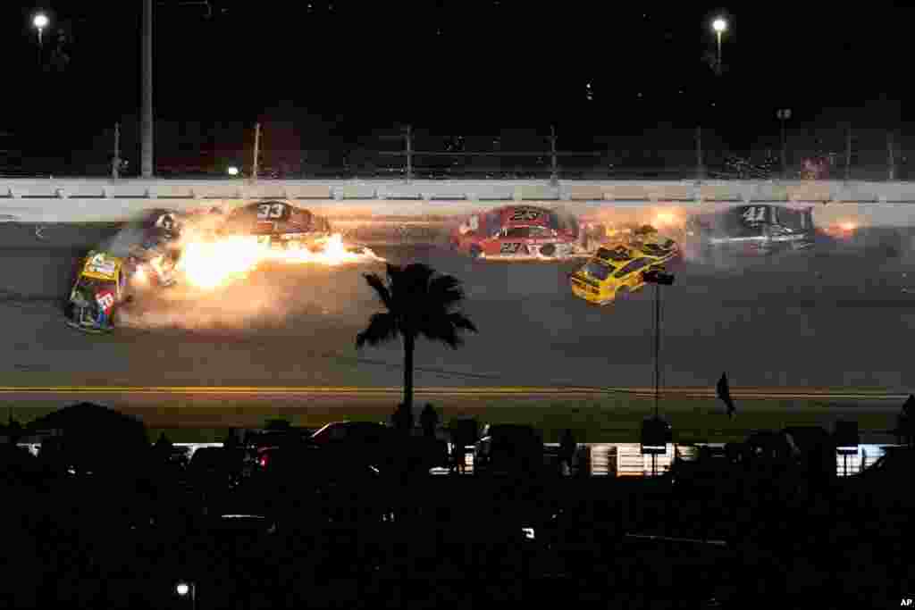 Racers crash during the last lap in the NASCAR Daytona 500 auto race at Daytona International Speedway in Daytona Beach, Florida.