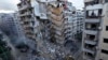 Bulldozers remove the rubble of a destroyed building that was hit Sunday night in an Israeli airstrike in Dahiyeh, in the southern suburb of Beirut, Lebanon, Nov. 25, 2024. 