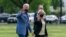 President Joe Biden with first lady Jill Biden wave as they walk on the Ellipse near the White House after spending the weekend in Wilmington, Del., April 25, 2021, in Washington. 