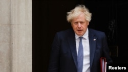 FILE PHOTO: British PM Johnson leaves the 10 Downing Street, in London