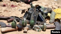 Ammunition used by suspected al Shabaab assailants killed during an attack is displayed outside Somalia's regional government headquarters in the central city of Baidoa, March 12, 2015. 